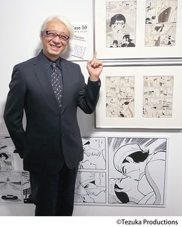 会場に展示された横浜ゆかりの作品『めぐり会い』の直筆原画と手塚眞さん（１月15日プレス内覧会で）