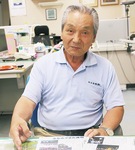 虫送りの歴史などについて説明する宮本会長